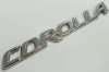 Эмблема-надпись "Corolla" 2.5*19.5см пластик (арт. Corolla)